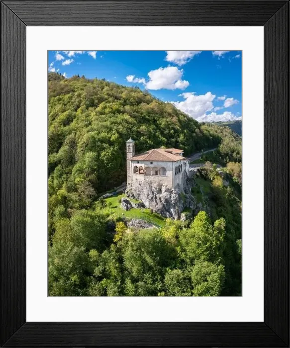 Framed Print : Aerial view of the San Patrizio sanctuary on a hill overlooking Casnigo and Valle Seriana