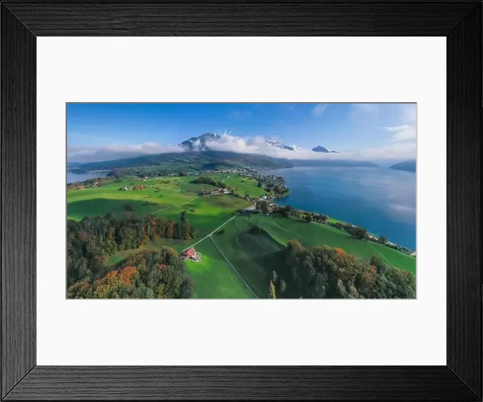 Framed Print : Switzerland aerial flight. Weggis city on the shore of Lake Lucerne. The top of Mount Rigi Framed Print : Switzerland aerial flight. Weggis city on the shore of Lake Lucerne. The top of Mount Rigi