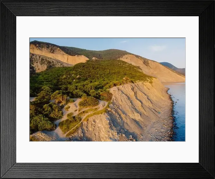 Framed Print : Aerial view of coastline with sea, mountains, canyon and cliffs with sunset light Framed Print : Aerial view of coastline with sea, mountains, canyon and cliffs with sunset light