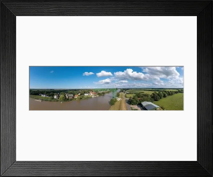 Framed Print : Aerial view with the transporter bridge Osten-Hemmoor over river Oste, Osten, Lower Saxony, Germany, Europe Framed Print : Aerial view with the transporter bridge Osten-Hemmoor over river Oste, Osten, Lower Saxony, Germany, Europe