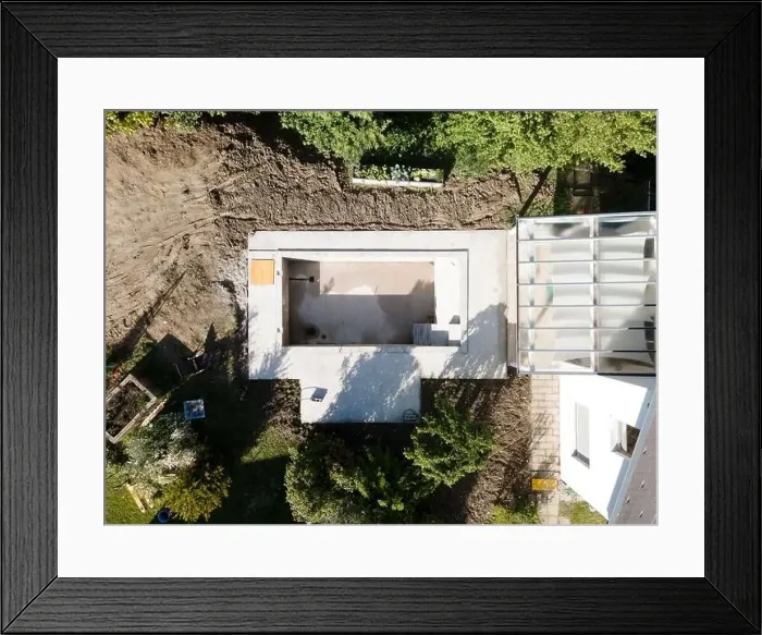 Framed Print : Drone shot of pool construction site in a garden, earth around the pool is already backfilled Framed Print : Drone shot of pool construction site in a garden, earth around the pool is already backfilled