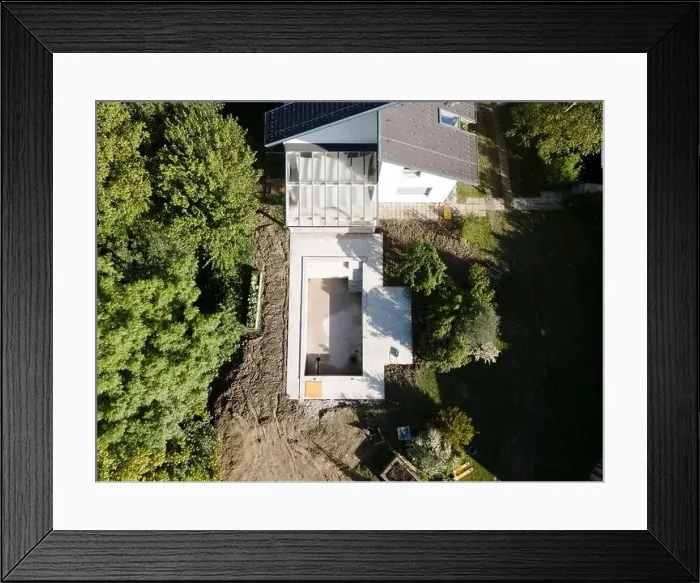 Framed Print : Drone shot of pool construction site in a garden, earth around the pool is already backfilled Framed Print : Drone shot of pool construction site in a garden, earth around the pool is already backfilled