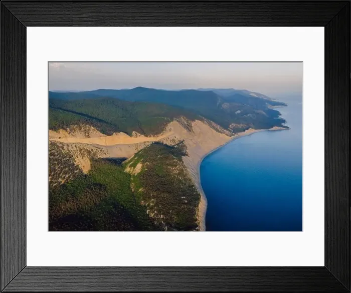 Framed Print : Aerial view of coastline with sea, mountains, canyon and cliffs with evening light