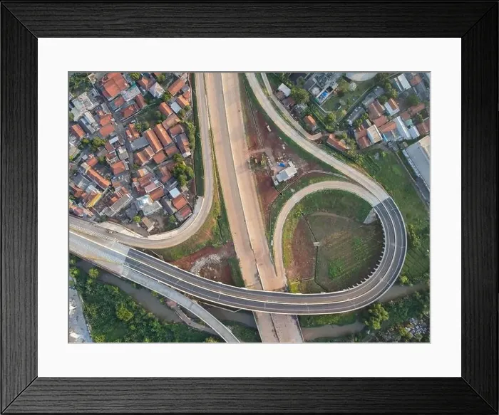 Framed Print : Aerial view on the new road construction site. Bekasi, Indonesia, May 31, 2021 Framed Print : Aerial view on the new road construction site. Bekasi, Indonesia, May 31, 2021