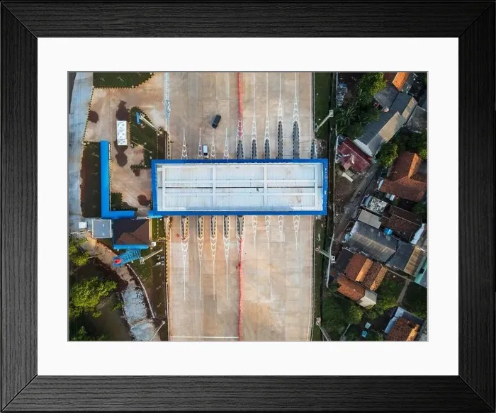 Framed Print : Aerial view on the new road construction site. Bekasi, Indonesia, May 31, 2021 Framed Print : Aerial view on the new road construction site. Bekasi, Indonesia, May 31, 2021