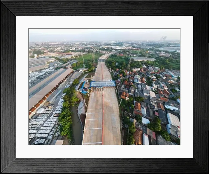 Framed Print : Aerial view on the new road construction site. Bekasi, Indonesia, May 31, 2021 Framed Print : Aerial view on the new road construction site. Bekasi, Indonesia, May 31, 2021