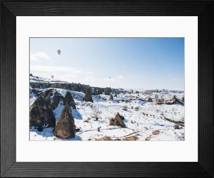 Framed Print : Amazing drone view of colorful hot air balloons flying over old Uchisar settlement Framed Print : Amazing drone view of colorful hot air balloons flying over old Uchisar settlement