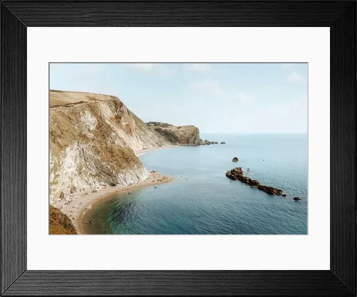 Framed Print : From above idyllic seascape with rocks called Durdle Door and people relaxing on seashore on summer day Framed Print : From above idyllic seascape with rocks called Durdle Door and people relaxing on seashore on summer day