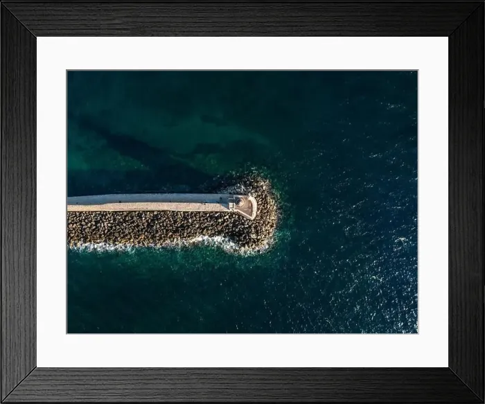 Framed Print : Aerial top view by drone of iconic Venetian lighthouse in the entrance of picturesque old port of Chania at sunset Framed Print : Aerial top view by drone of iconic Venetian lighthouse in the entrance of picturesque old port of Chania at sunset