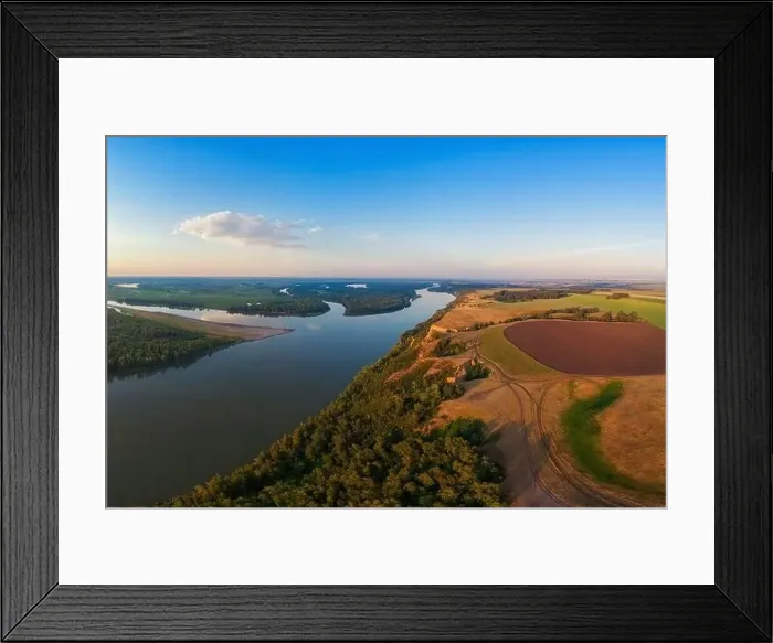 Framed Print : Aerial drone view of river landscape in sunny summer evening Framed Print : Aerial drone view of river landscape in sunny summer evening