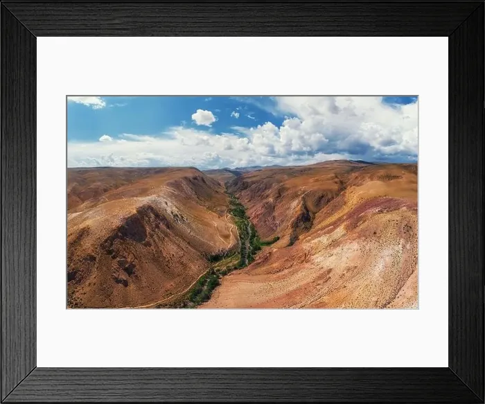 Framed Print : Aerial shot of the textured yellow nad red mountains resembling the surface of Mars Framed Print : Aerial shot of the textured yellow nad red mountains resembling the surface of Mars