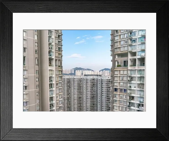 Framed Print : The view of residential neighborhood and skyscrapers from rooftop in Hong Kong Framed Print : The view of residential neighborhood and skyscrapers from rooftop in Hong Kong