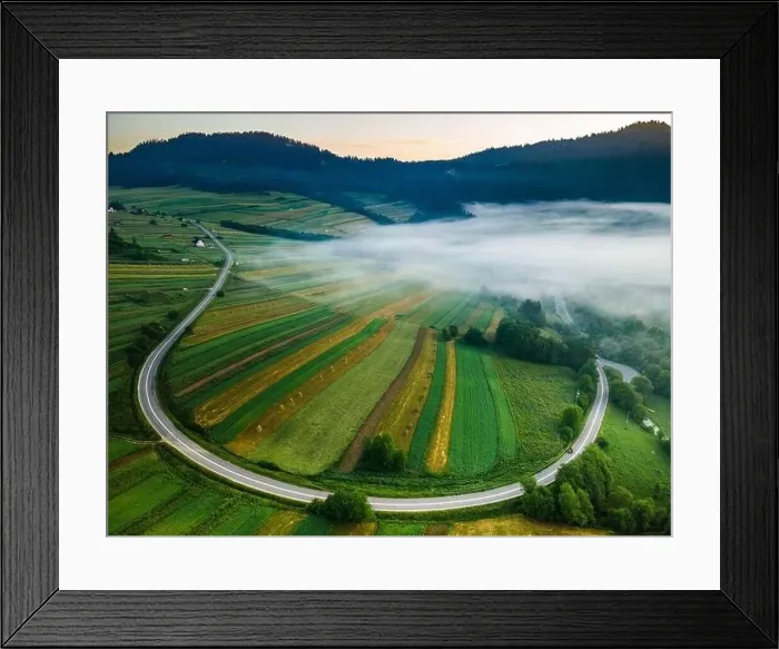 Framed Print : Morning Fog over Farm Fields and Curvy Road in Pieniny Park. Drone View Framed Print : Morning Fog over Farm Fields and Curvy Road in Pieniny Park. Drone View
