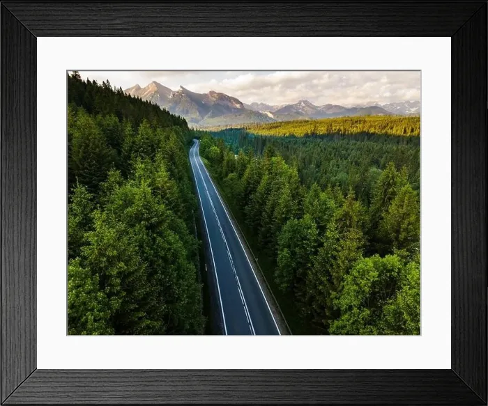 Framed Print : Road in Forest into Wilderness and Mountains Aerial Drone View Framed Print : Road in Forest into Wilderness and Mountains Aerial Drone View
