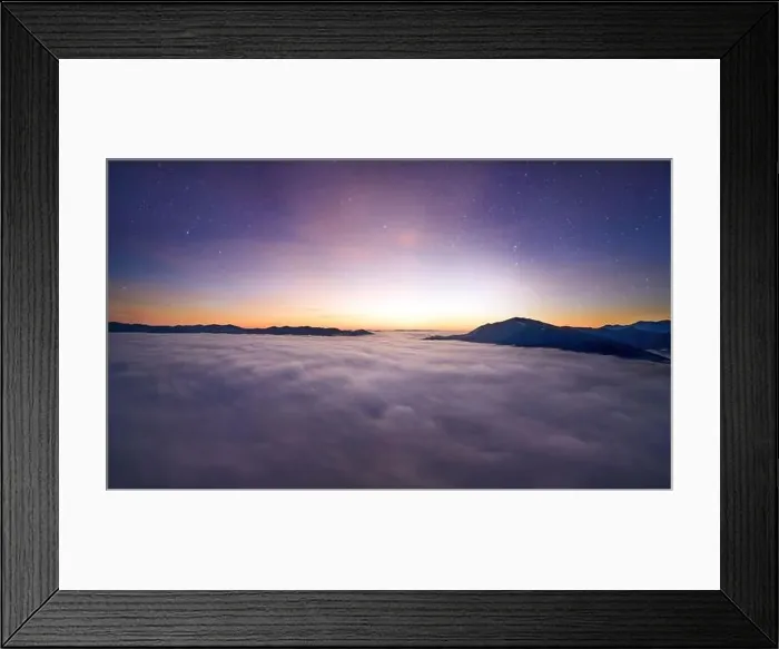Framed Print : View from the drone at dawn over the clouds with mountains on the grassland Framed Print : View from the drone at dawn over the clouds with mountains on the grassland