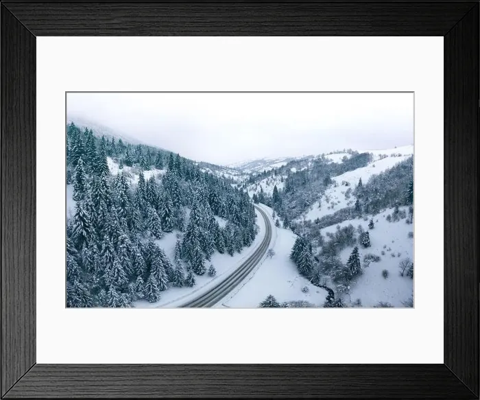 Framed Print : Mountain road forest winter view from drone Framed Print : Mountain road forest winter view from drone