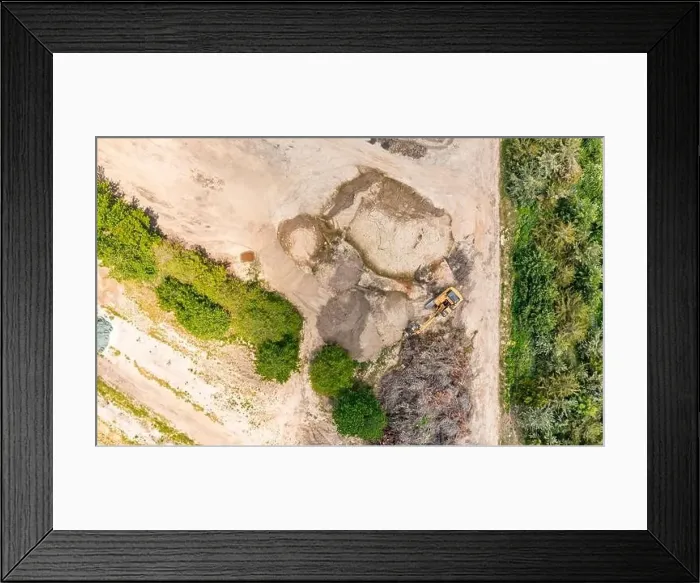 Framed Print : aerial view of an excavator in a landscape Framed Print : aerial view of an excavator in a landscape