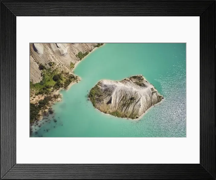 Framed Print : Stone on green lake water aerial above top view Framed Print : Stone on green lake water aerial above top view