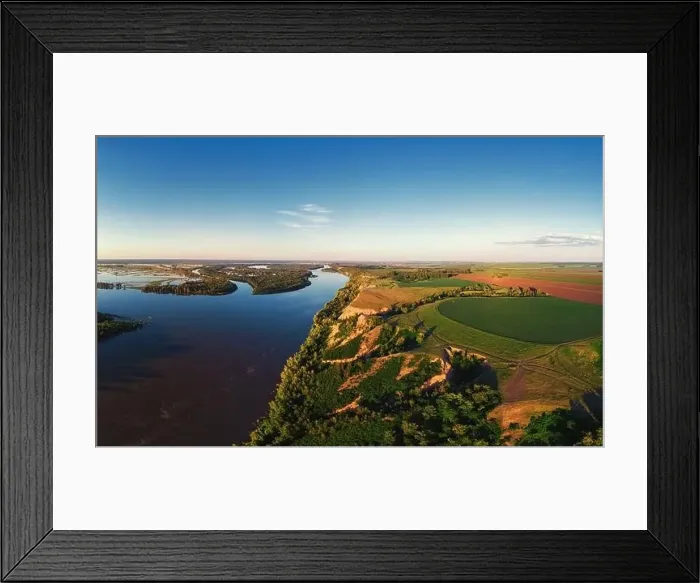 Framed Print : Aerial drone view of river landscape in sunny summer evening Framed Print : Aerial drone view of river landscape in sunny summer evening