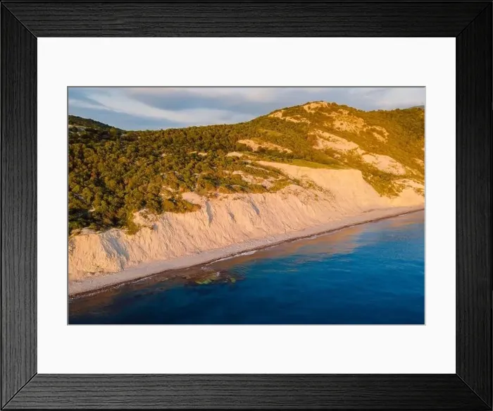 Framed Print : Aerial view of summer coastline with cliff, trees and quiet sea. Coastline with sunset colors Framed Print : Aerial view of summer coastline with cliff, trees and quiet sea. Coastline with sunset colors