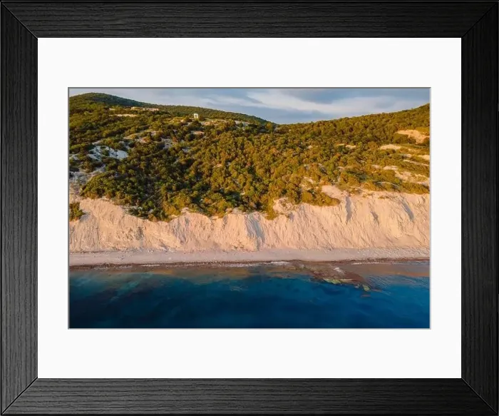 Framed Print : Aerial view of summer coastline with cliff, trees and quiet sea. Coastline with sunset colors Framed Print : Aerial view of summer coastline with cliff, trees and quiet sea. Coastline with sunset colors
