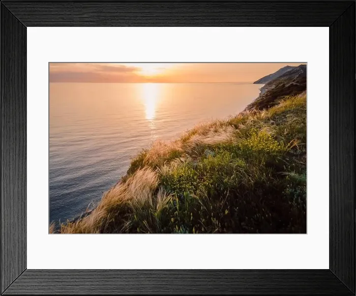 Framed Print : Aerial view of summer coastline with grass and quiet sea. Coastline with sunset colors Framed Print : Aerial view of summer coastline with grass and quiet sea. Coastline with sunset colors