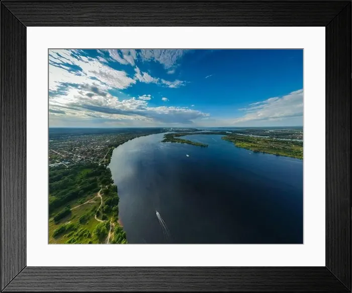 Framed Print : Aerial view from a drone on a fresh river among a green meadow in summer outdoor Framed Print : Aerial view from a drone on a fresh river among a green meadow in summer outdoor