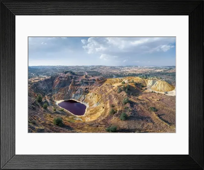 Framed Print : Toxic lake in abandoned open pit copper mine and waste heaps near Kampia, Cyprus. Aerial panorama Framed Print : Toxic lake in abandoned open pit copper mine and waste heaps near Kampia, Cyprus. Aerial panorama