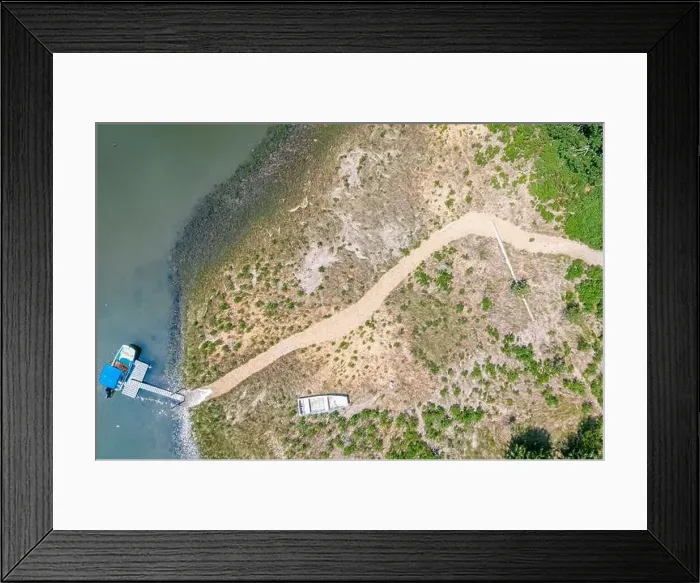 Framed Print : aerial image of a motorboat at a private dock Framed Print : aerial image of a motorboat at a private dock