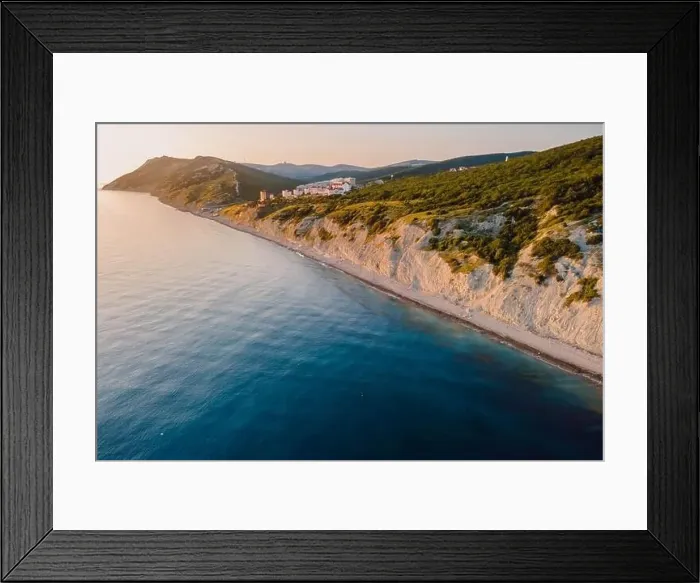 Framed Print : Aerial view of summer coastline with grass and blue sea. Coastline with sunset colors Framed Print : Aerial view of summer coastline with grass and blue sea. Coastline with sunset colors