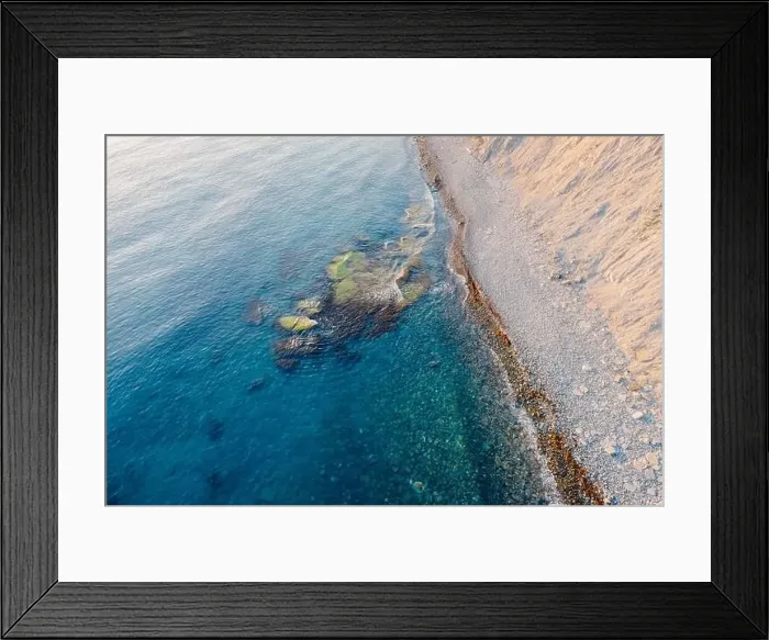 Framed Print : Aerial view of sea surface with stones and coastline Framed Print : Aerial view of sea surface with stones and coastline