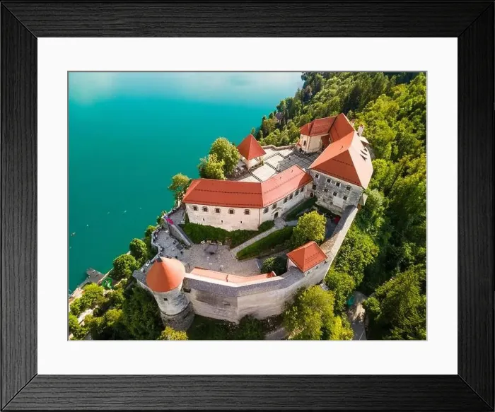 Framed Print : Bled Castle above Lake Bled in Slovenia in Summer. Aerial Drone View Framed Print : Bled Castle above Lake Bled in Slovenia in Summer. Aerial Drone View