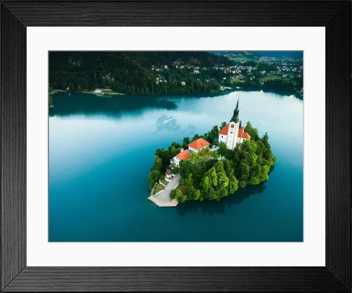 Framed Print : Drone View on Church on Island on Lake Bled in Slovenia at Summer Framed Print : Drone View on Church on Island on Lake Bled in Slovenia at Summer