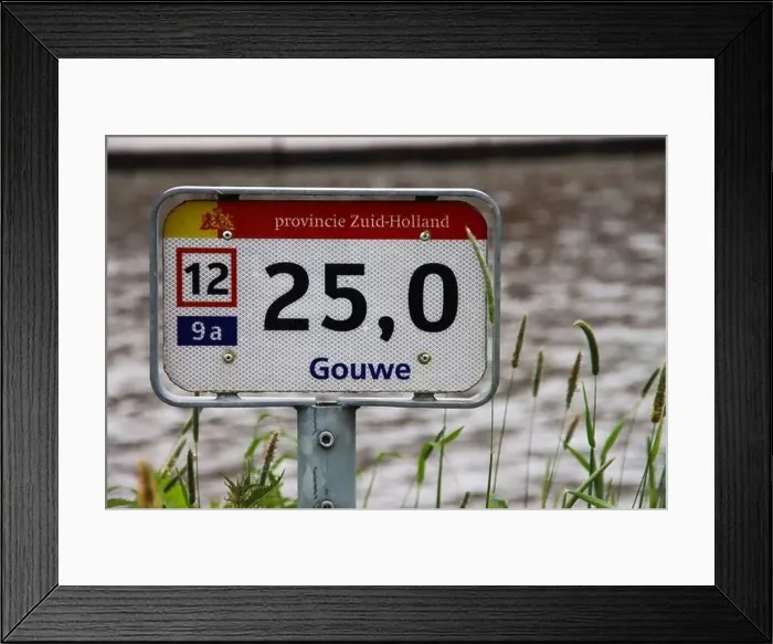 Framed Print : Distance sign along Gouwe canal for ships on the water in the Netherlands Framed Print : Distance sign along Gouwe canal for ships on the water in the Netherlands