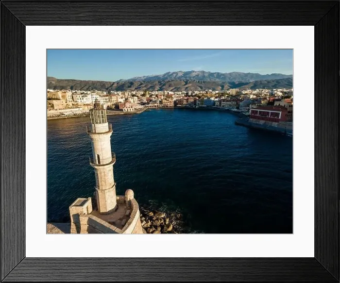 Framed Print : Aerial top view by drone of iconic Venetian lighthouse in the entrance of picturesque old port of Chania at sunset Framed Print : Aerial top view by drone of iconic Venetian lighthouse in the entrance of picturesque old port of Chania at sunset