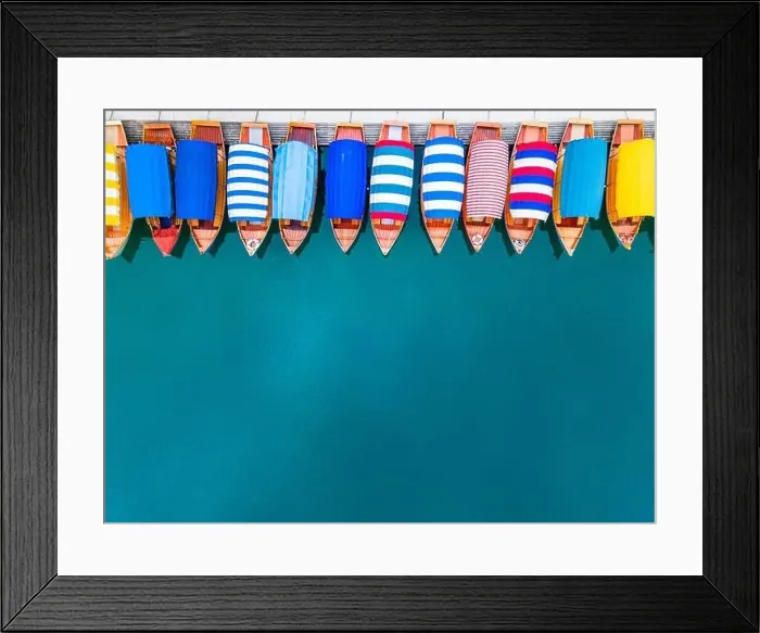 Framed Print : Colorful Boats on Lake Bled in Slovenia. Travel Wallpaper or Background Framed Print : Colorful Boats on Lake Bled in Slovenia. Travel Wallpaper or Background