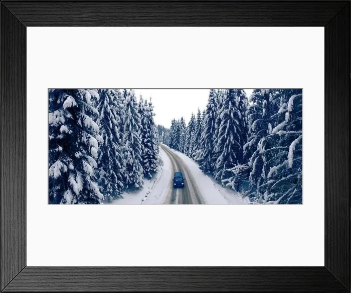 Framed Print : Wonderful winter mountain landscape. Road in the winter snowy forest. Drone view Framed Print : Wonderful winter mountain landscape. Road in the winter snowy forest. Drone view