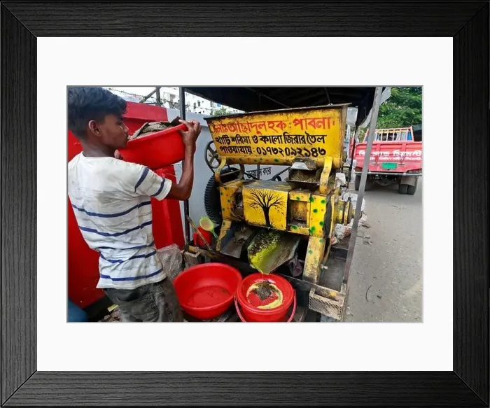 Framed Print : Dhaka, Bangladesh - August 22, 2021: A mustard oil seller in Badda Framed Print : Dhaka, Bangladesh - August 22, 2021: A mustard oil seller in Badda