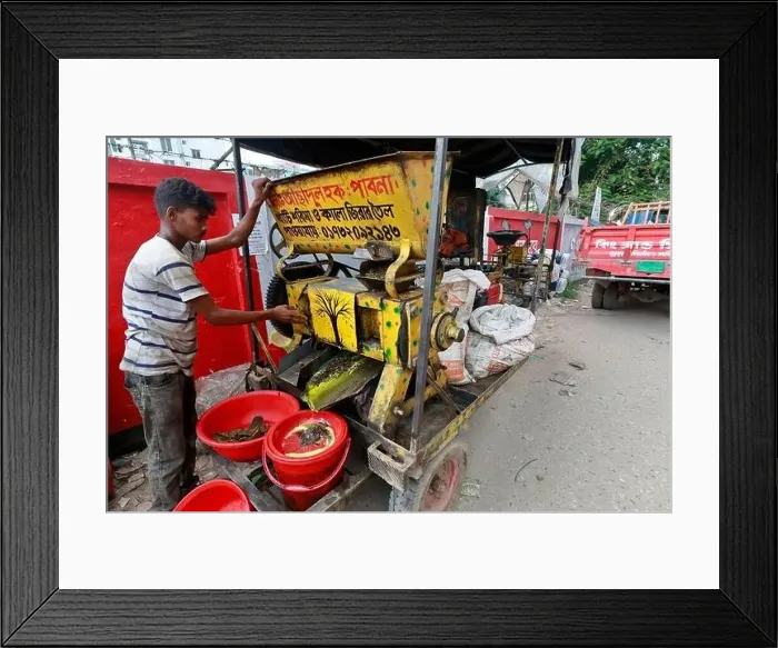 Framed Print : Dhaka, Bangladesh - August 22, 2021: A mustard oil seller in Badda Framed Print : Dhaka, Bangladesh - August 22, 2021: A mustard oil seller in Badda