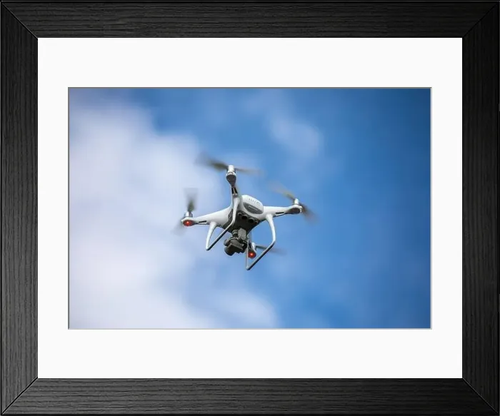 Framed Print : Drone quadrocopter with high resolution digital camera on the sky background Framed Print : Drone quadrocopter with high resolution digital camera on the sky background