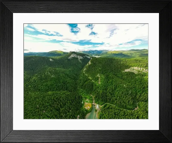 Framed Print : Birds eye view of a lake in the mountains surrounded by a green pine forest Framed Print : Birds eye view of a lake in the mountains surrounded by a green pine forest