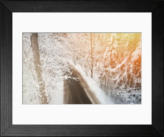 Framed Print : Dirty road in white winter snowy forest aerial drone view Framed Print : Dirty road in white winter snowy forest aerial drone view