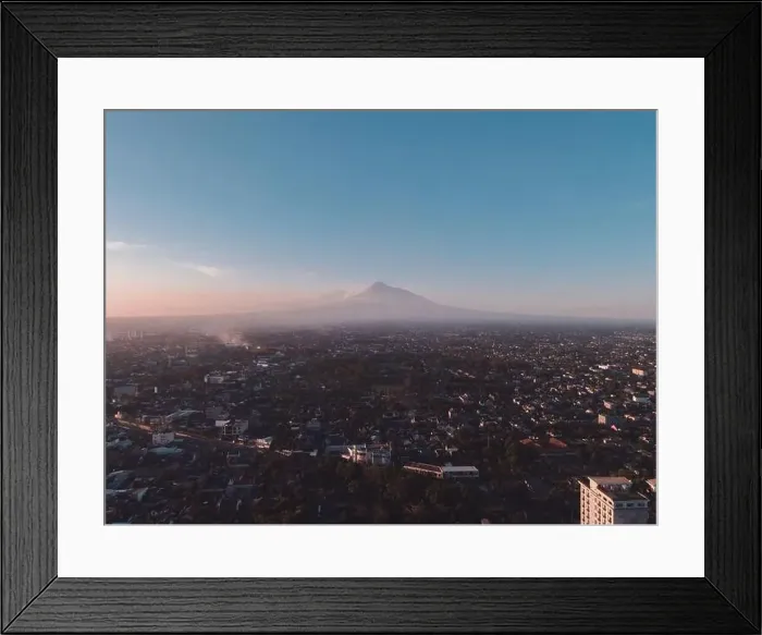 Framed Print : Aerial view of sunset Mount Merapi and Yogyakarta city, Indonesia. City with mountain background view Framed Print : Aerial view of sunset Mount Merapi and Yogyakarta city, Indonesia. City with mountain background view