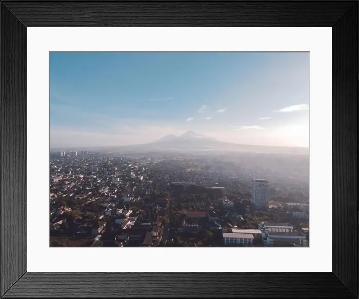 Framed Print : Aerial view of sunset Mount Merapi and Yogyakarta city, Indonesia. City with mountain background view Framed Print : Aerial view of sunset Mount Merapi and Yogyakarta city, Indonesia. City with mountain background view