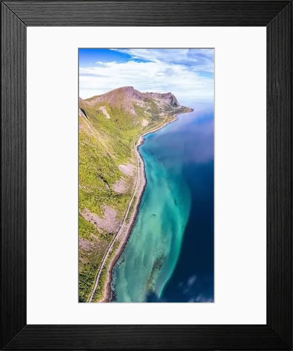 Framed Print : Aerial view of coastal road nearby the crystal sea at feet of Husfjellet mountain Framed Print : Aerial view of coastal road nearby the crystal sea at feet of Husfjellet mountain