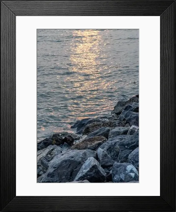 Framed Print : Rocks and sea : View of sea waves hitting rocks on the Calm beach in the morning. No focus, specifically