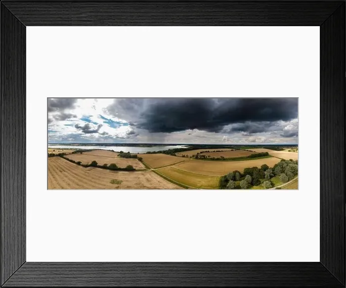 Framed Print : Aerial panoramic of the British countryside with a thunderstorm rolling in Framed Print : Aerial panoramic of the British countryside with a thunderstorm rolling in