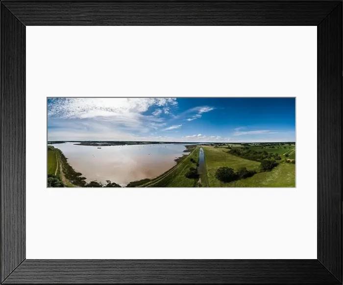 Framed Print : Aerial panoramic of the River Deben in Suffolk, there is a group of people racing sailing boats in the distance Framed Print : Aerial panoramic of the River Deben in Suffolk, there is a group of people racing sailing boats in the distance