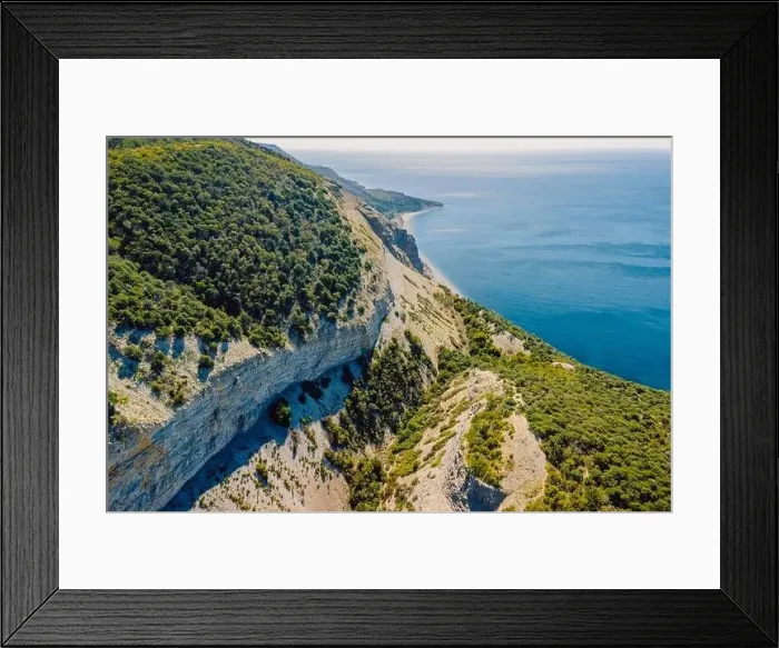 Framed Print : Aerial view of coastline with blue sea, mountains, canyon and cliffs with daylight