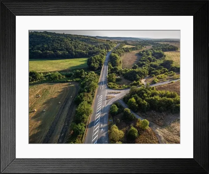 Framed Print : Road crossing the farmlands in eastern Bulgaria Framed Print : Road crossing the farmlands in eastern Bulgaria